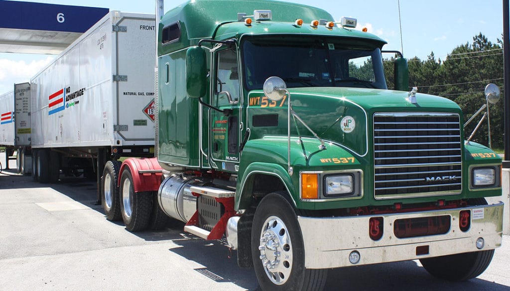 Two Tandem Trucks Filling Up